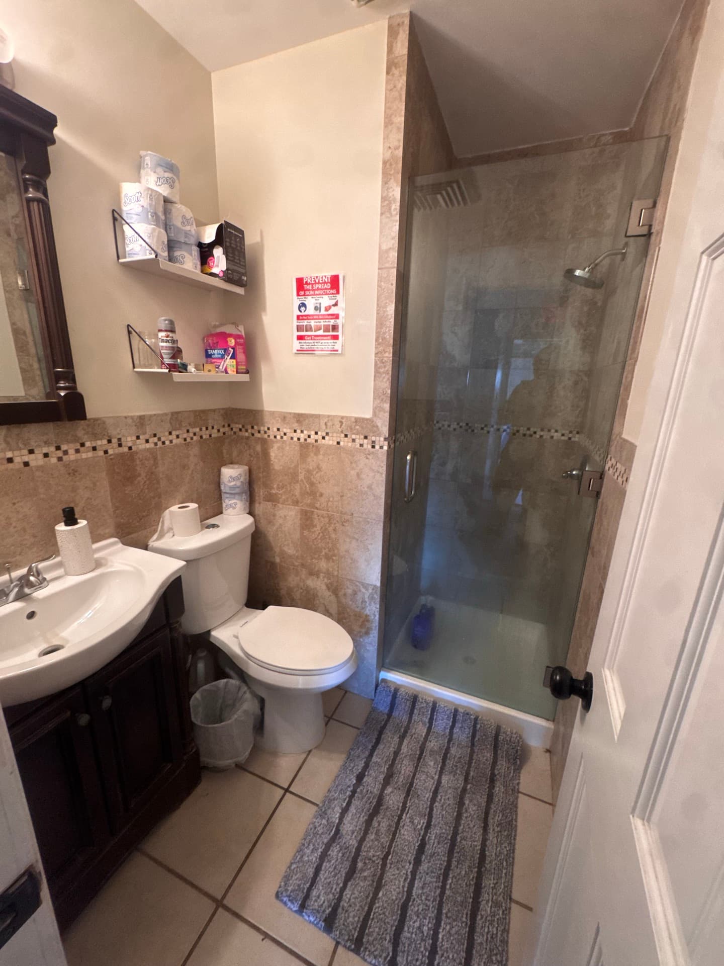 Bathroom with glass shower and dual sinks