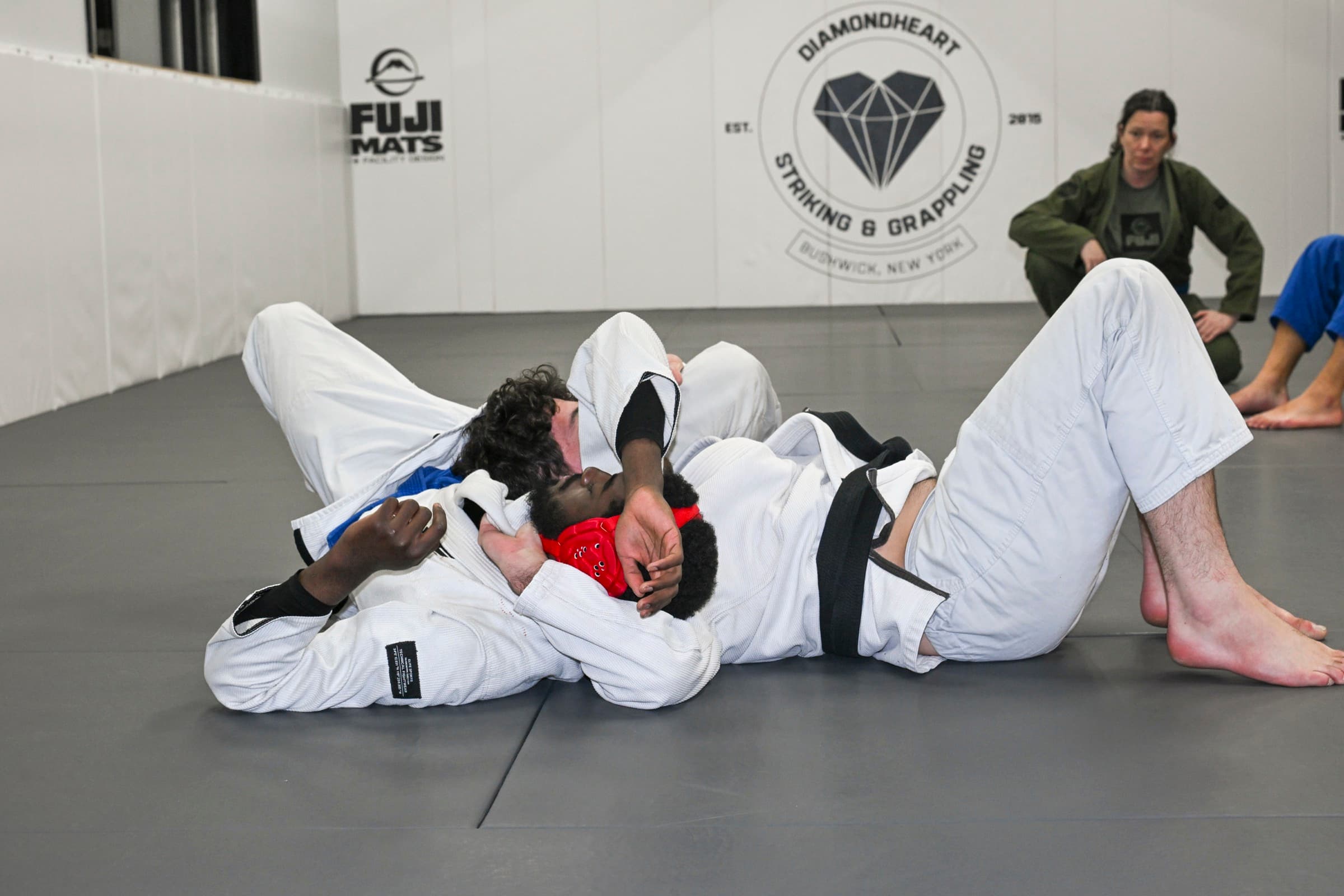 BJJ students rolling during class at DiamondHeart in Bushwick, Brooklyn